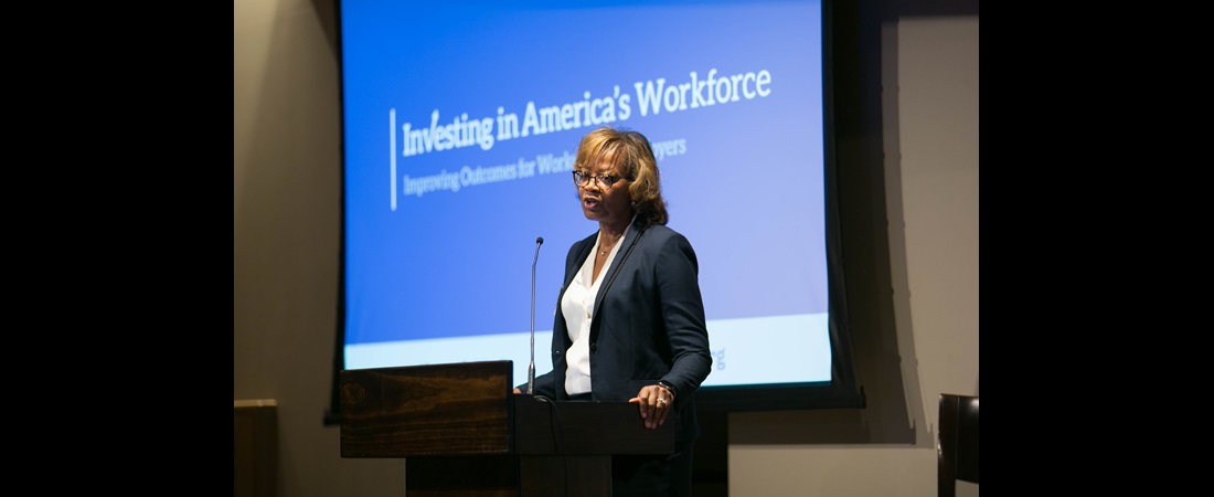 Women speaking on stage at The Investing in America's Workforce capstone conference